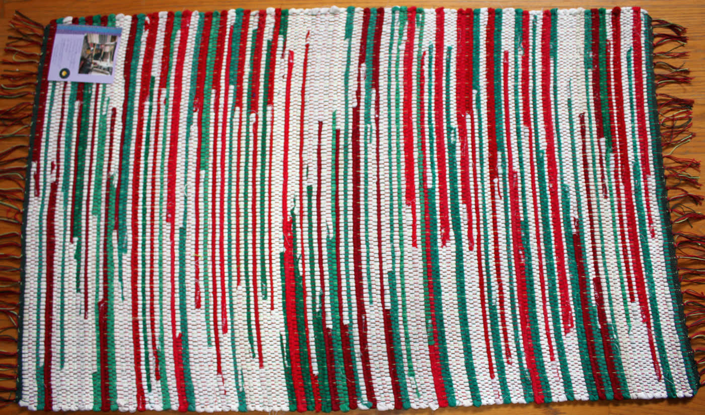 Red, green and white striped rag rug with fringe