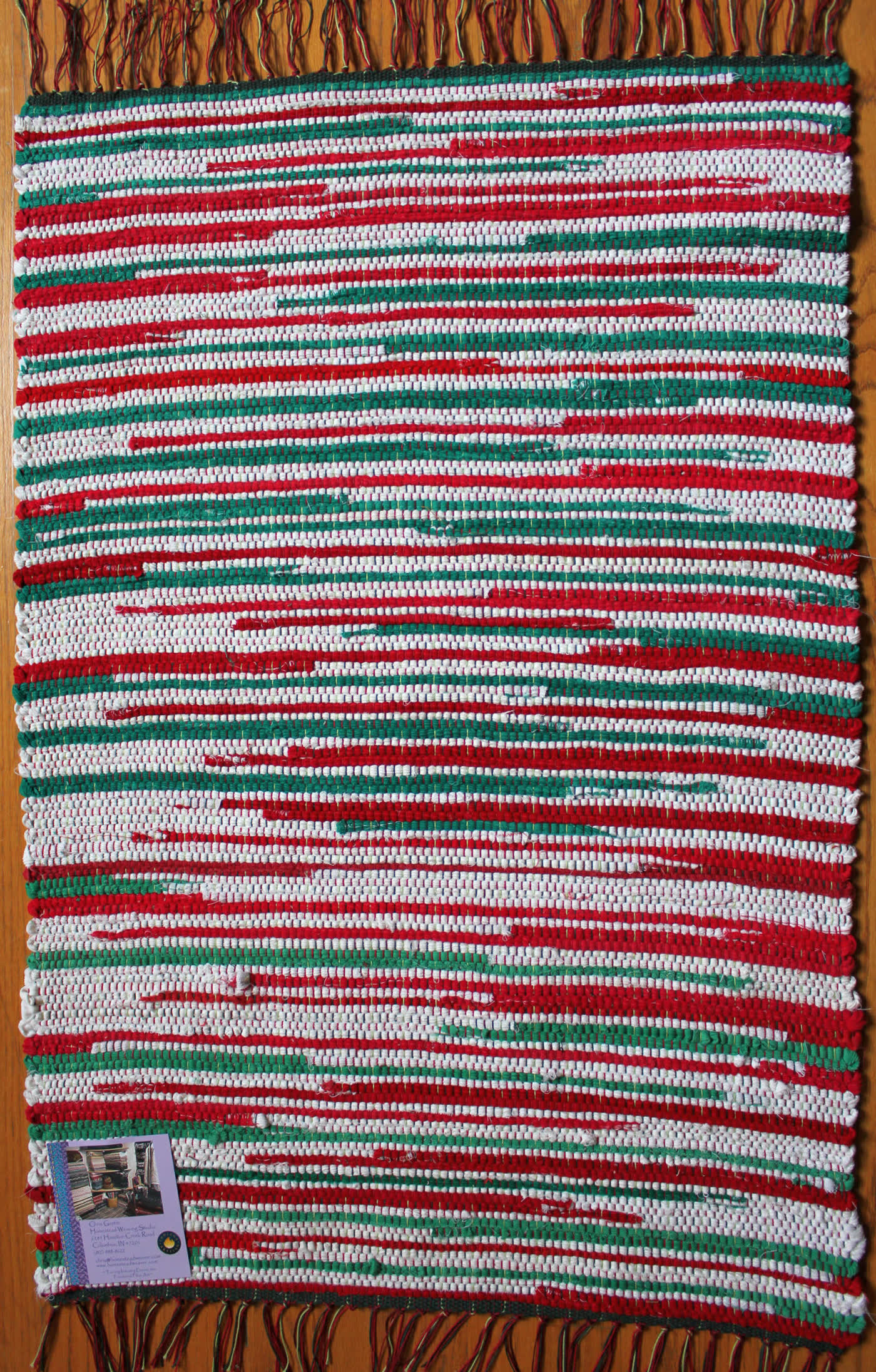 Red and green striped handwoven rug